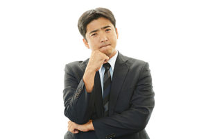 Dissatisfied Asian businessman